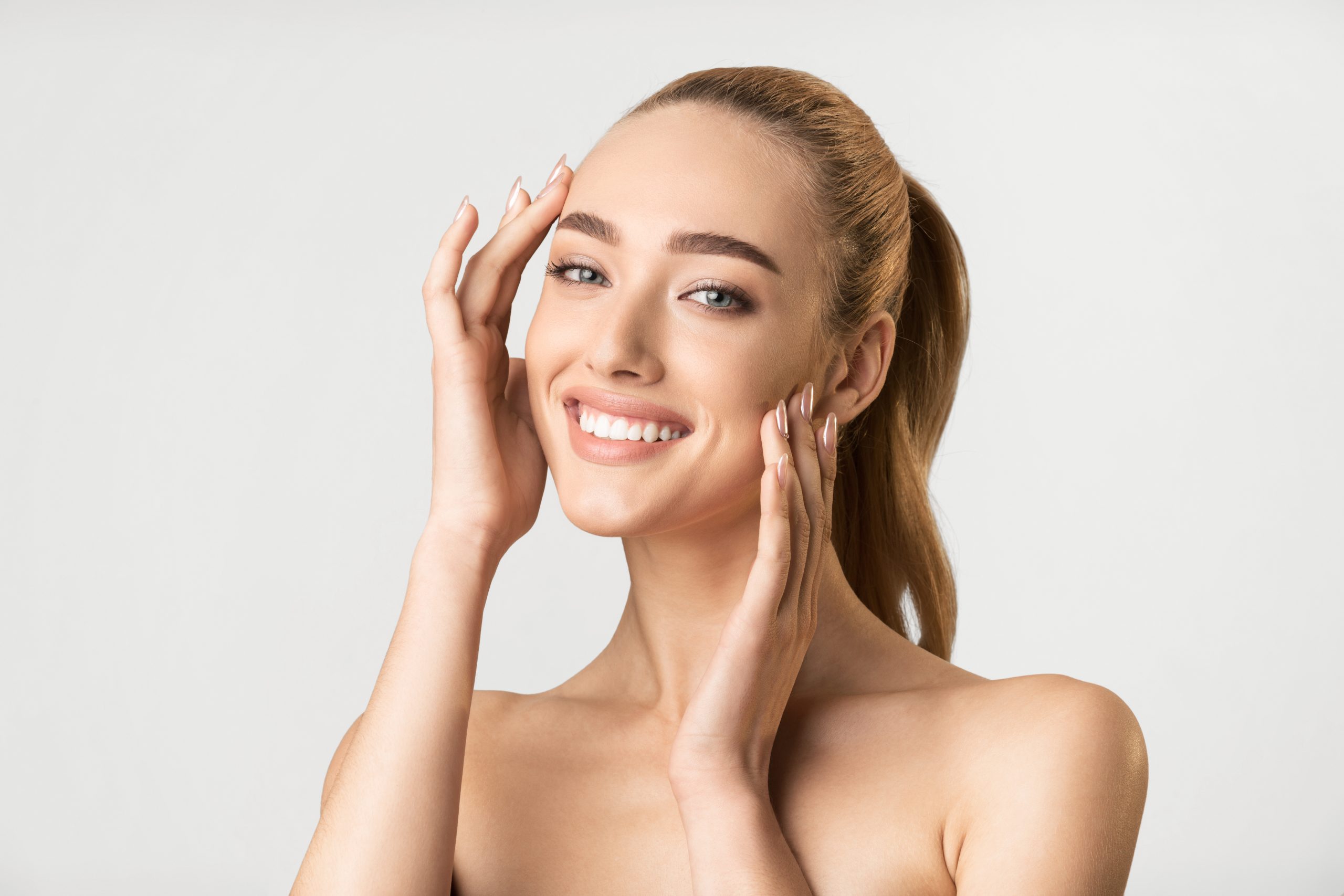 Cheerful Model Girl Posing Smiling Looking At Camera, Studio Shot